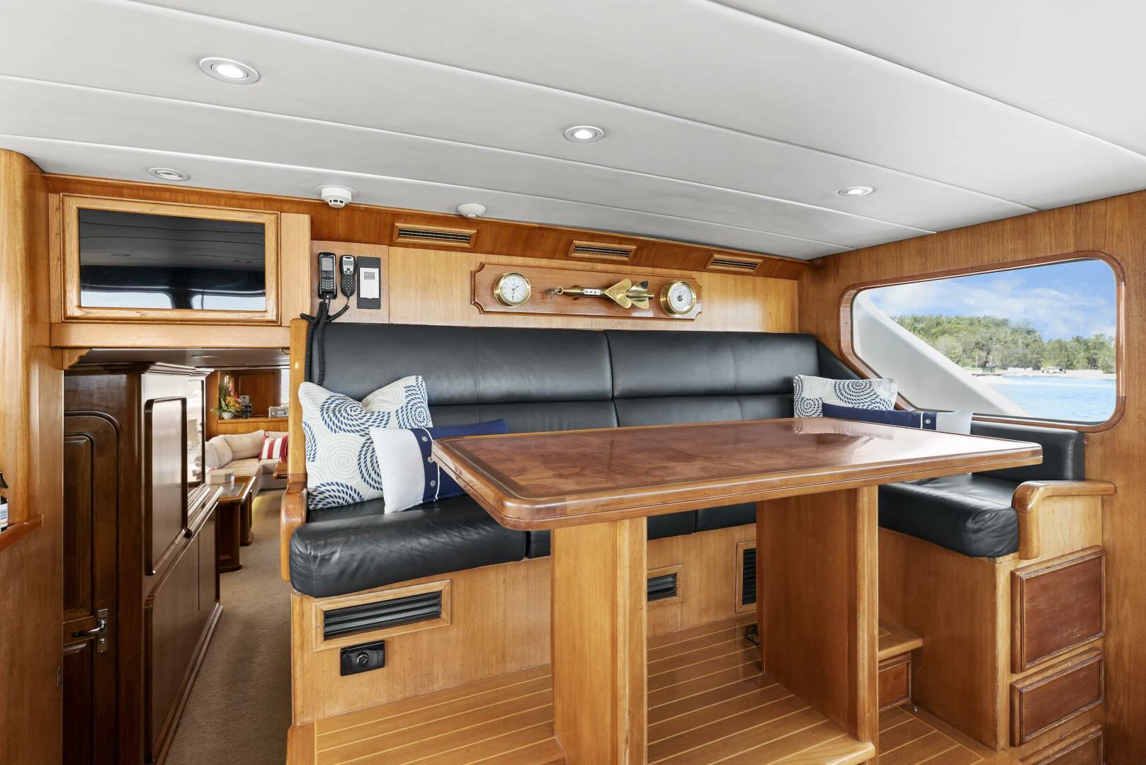 a room with a couch and a table aboard HUNTRESS Yacht for Sale