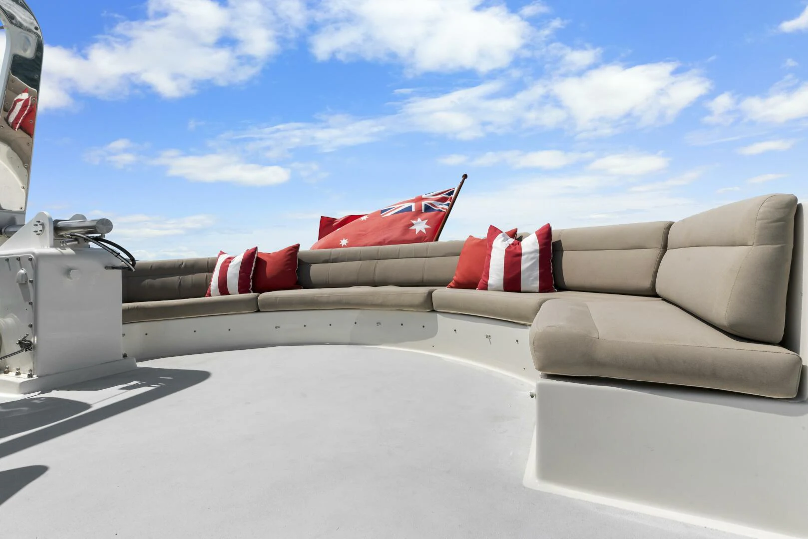 a car with a red and white stripe on the roof aboard HUNTRESS Yacht for Sale