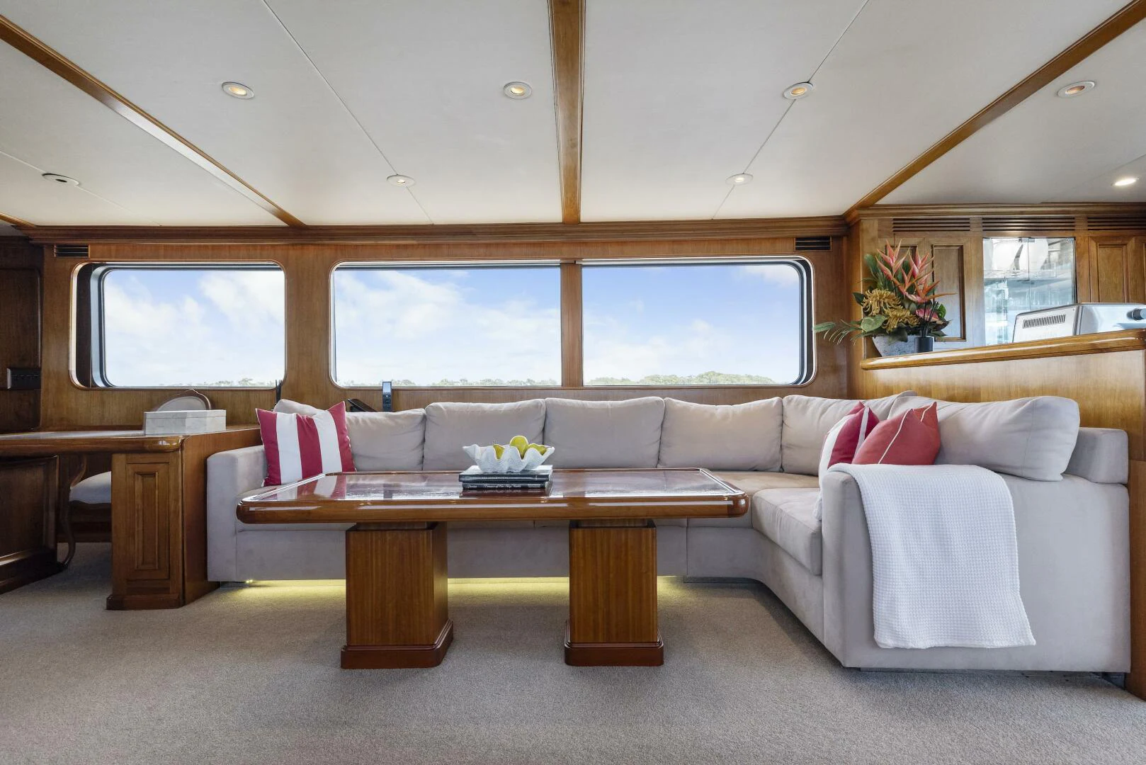 a living room with a couch and a table aboard HUNTRESS Yacht for Sale