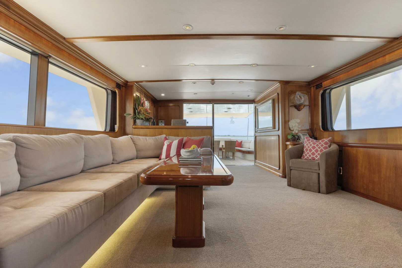 a living room with a couch and a coffee table aboard HUNTRESS Yacht for Sale