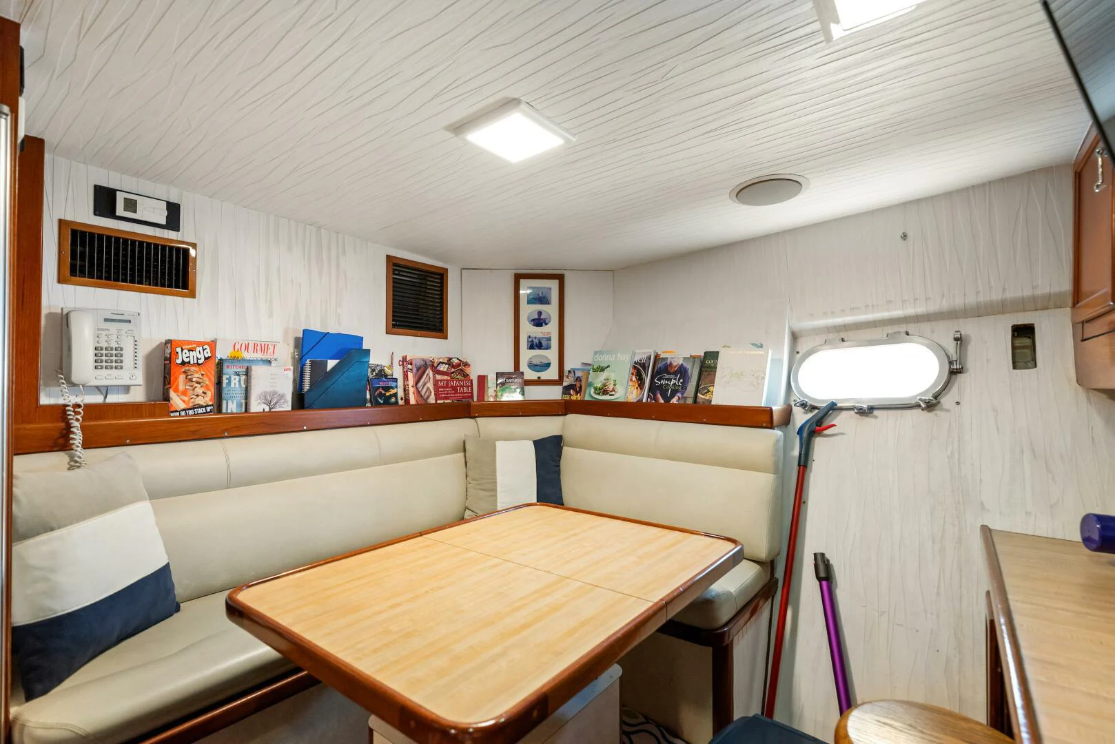 a room with a bed and a desk aboard HUNTRESS Yacht for Sale