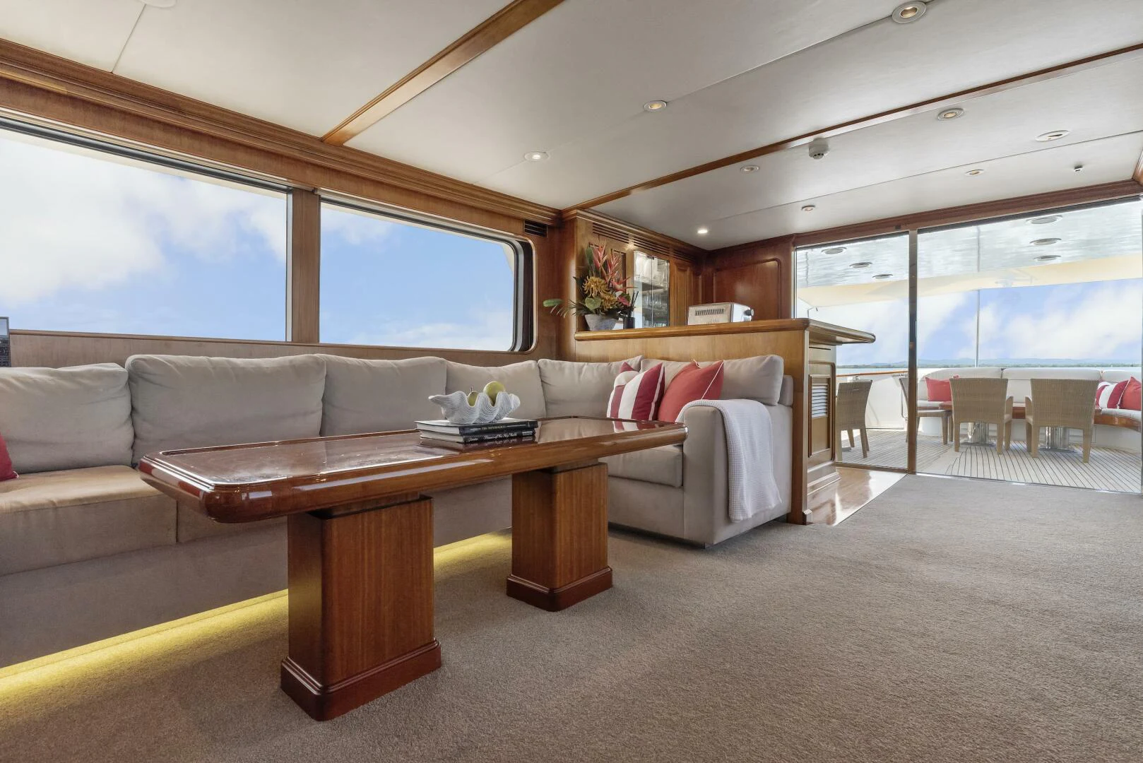a living room with a couch and a table aboard HUNTRESS Yacht for Sale