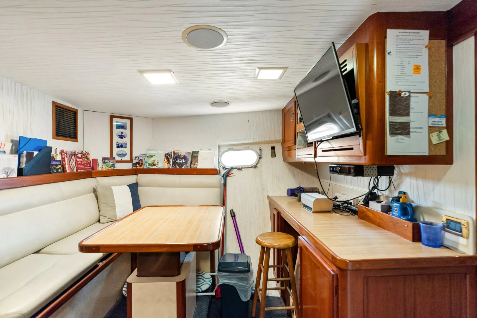 a room with a desk and a television aboard HUNTRESS Yacht for Sale