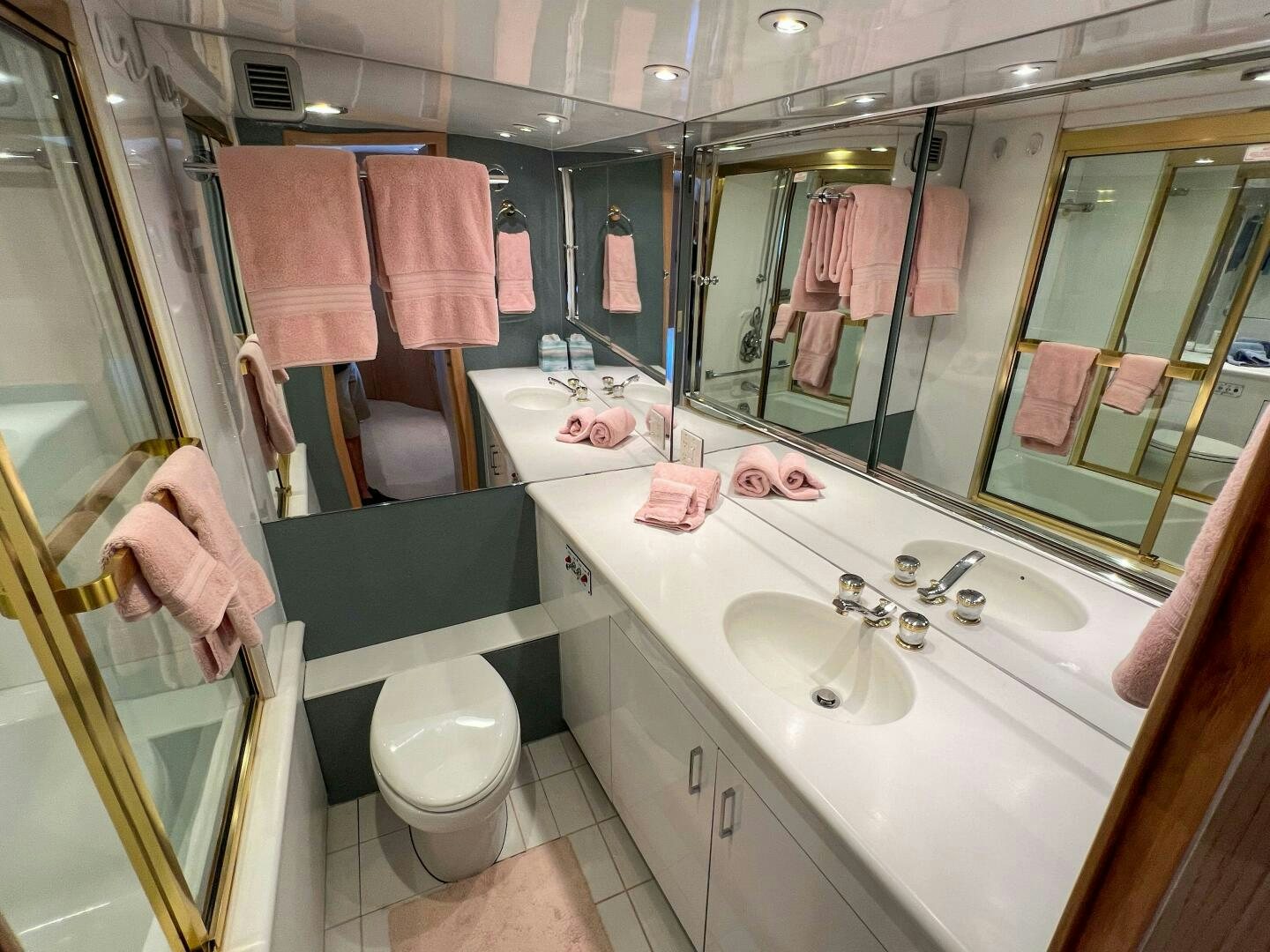 a bathroom with a sink and a mirror aboard AT EASE Yacht for Sale