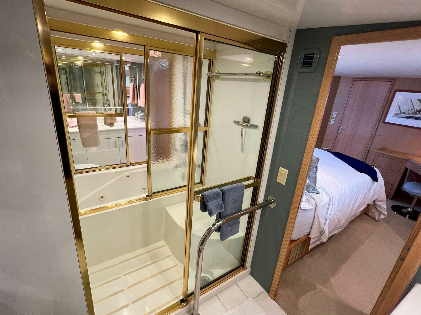 a bathroom with a glass shower aboard AT EASE Yacht for Sale
