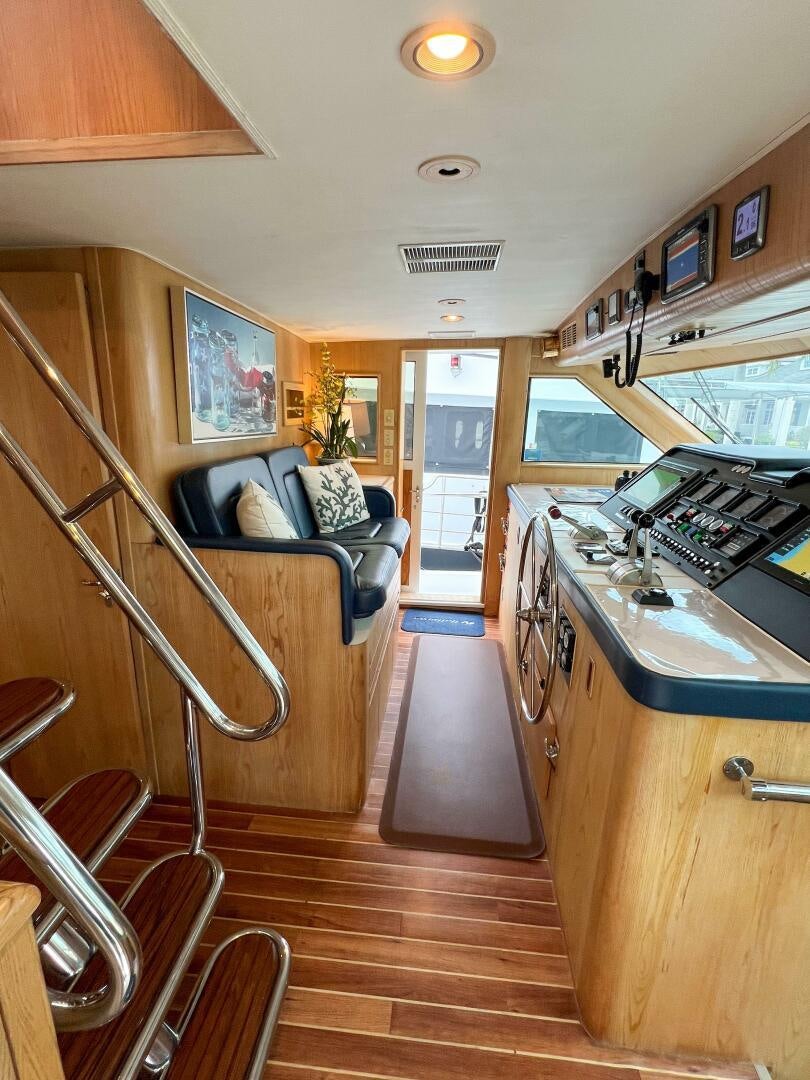 a room with a bunk bed and a ladder aboard AT EASE Yacht for Sale