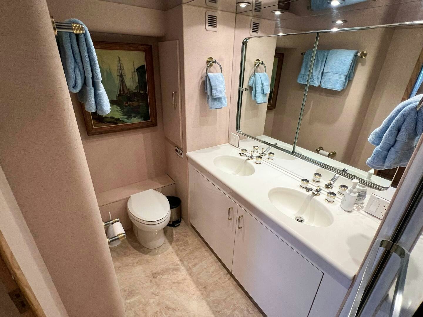 a bathroom with a large mirror aboard AT EASE Yacht for Sale