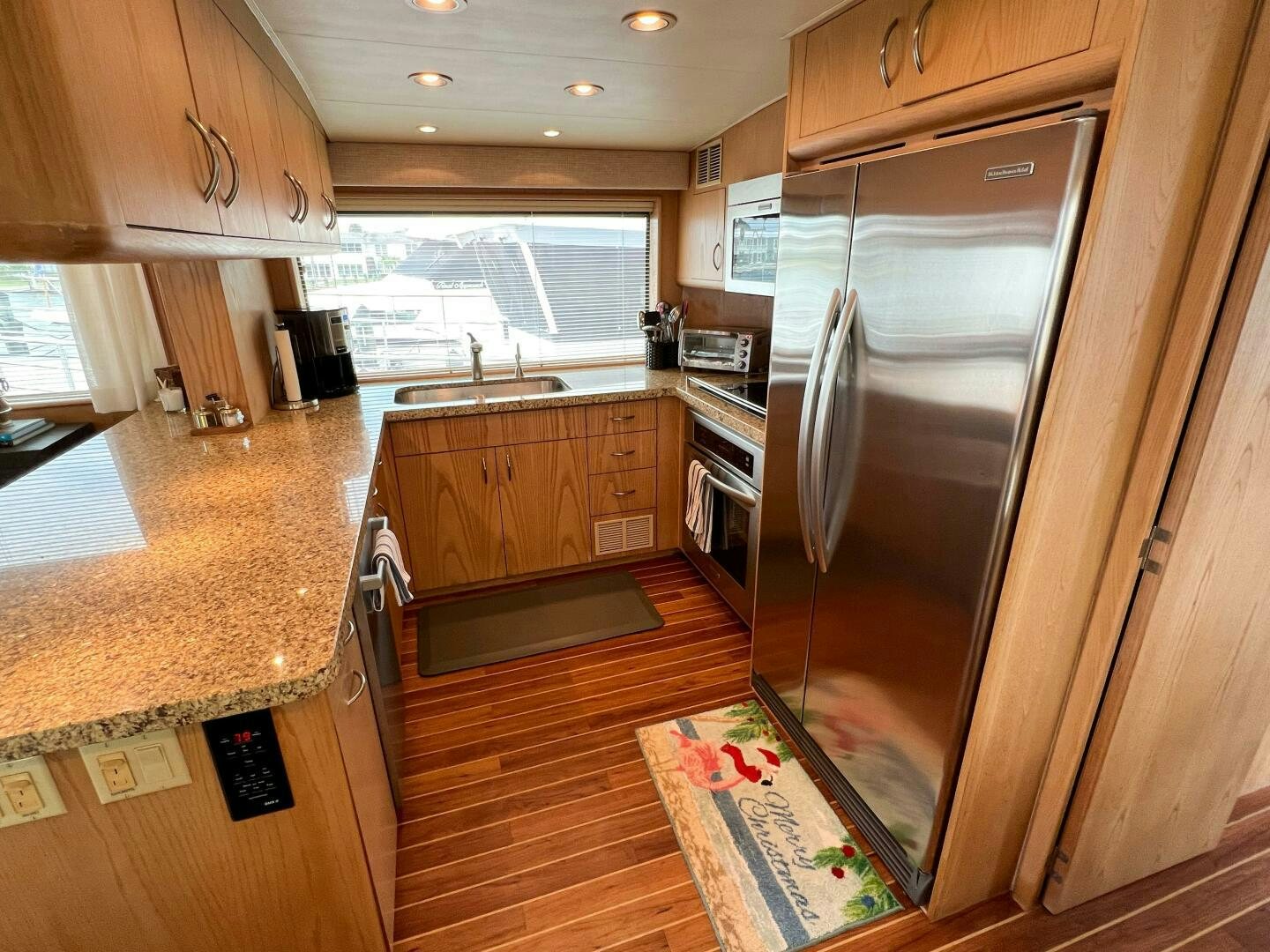 a kitchen with wooden cabinets aboard AT EASE Yacht for Sale