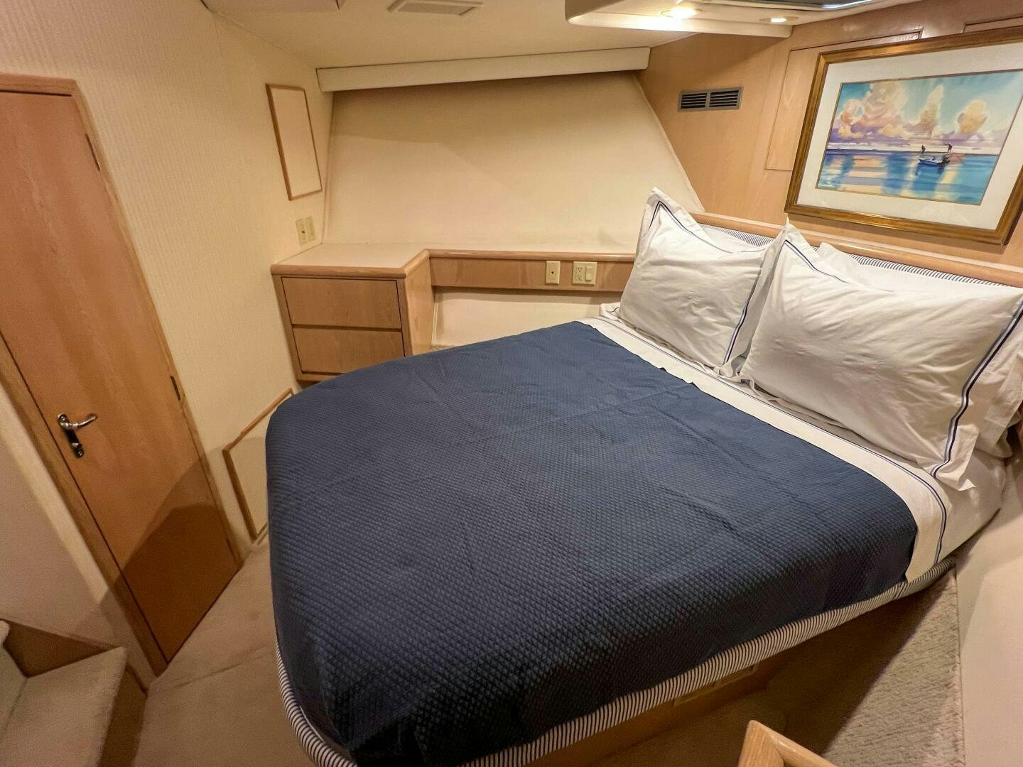 a bed with white sheets aboard AT EASE Yacht for Sale
