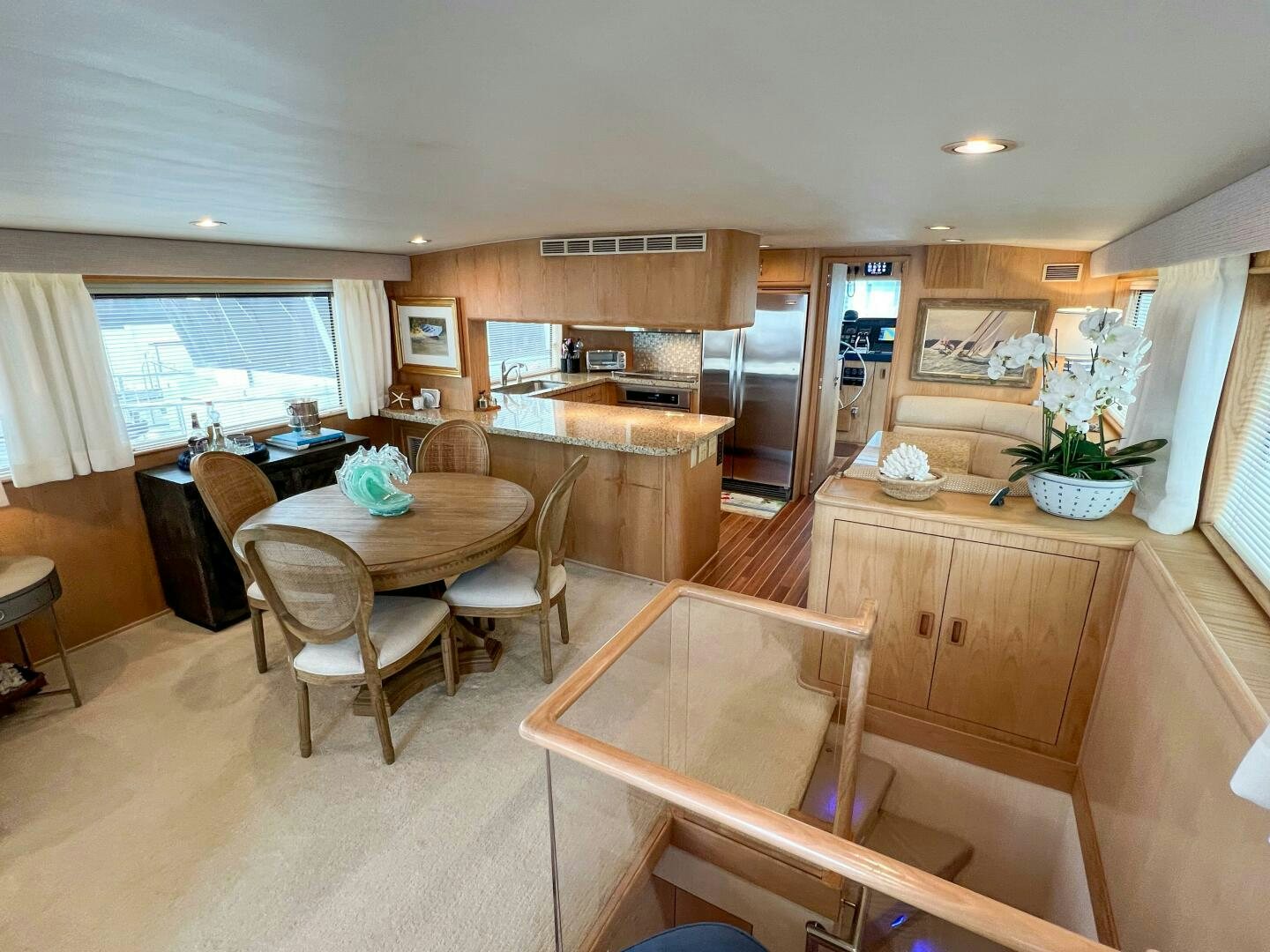 a kitchen with a dining table aboard AT EASE Yacht for Sale