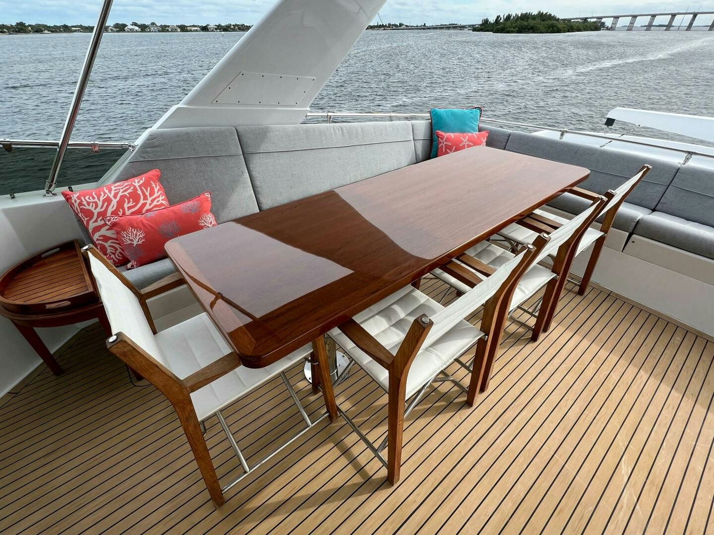 a table and chairs on a deck aboard AT EASE Yacht for Sale