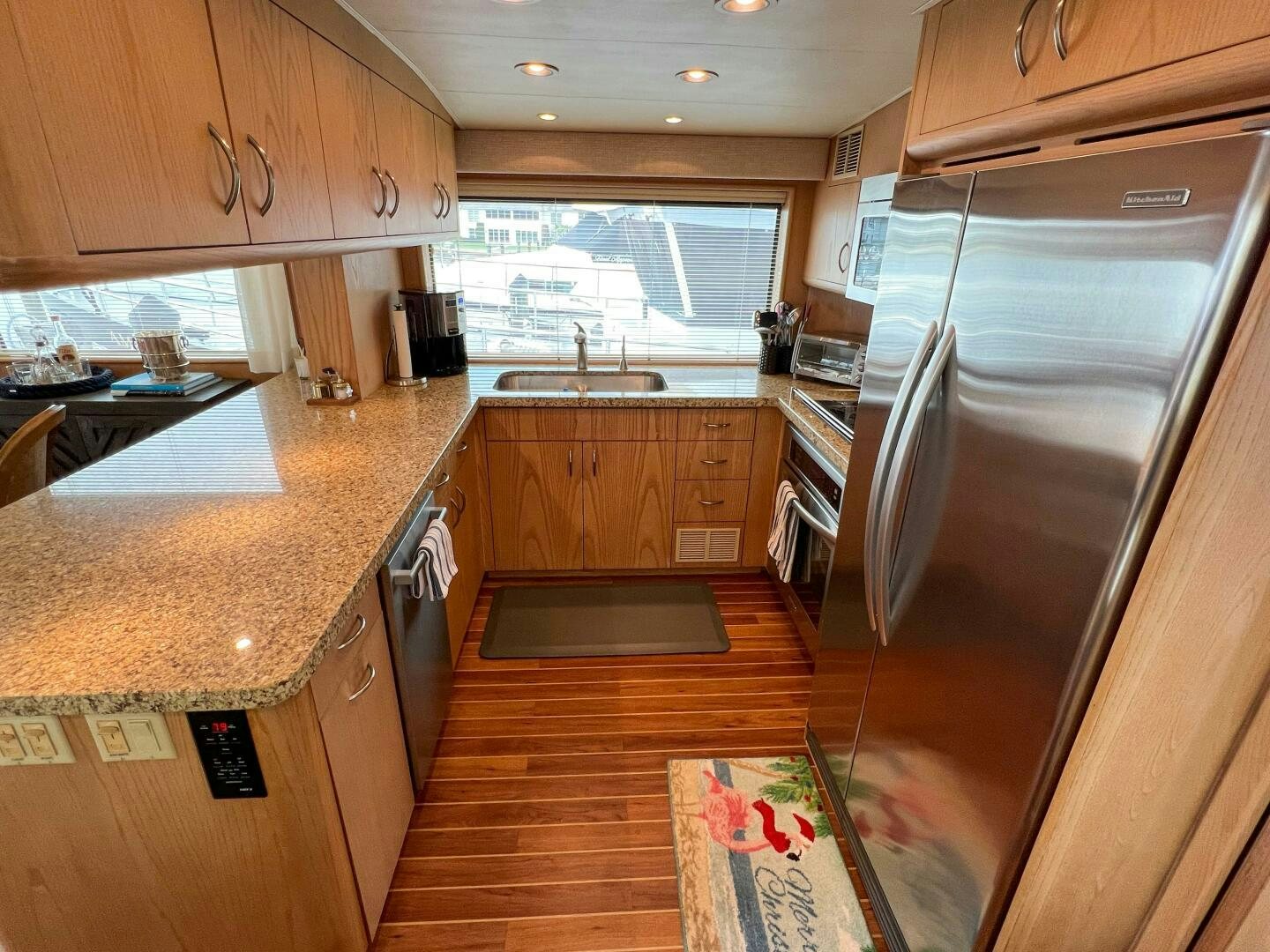 a kitchen with wooden cabinets aboard AT EASE Yacht for Sale