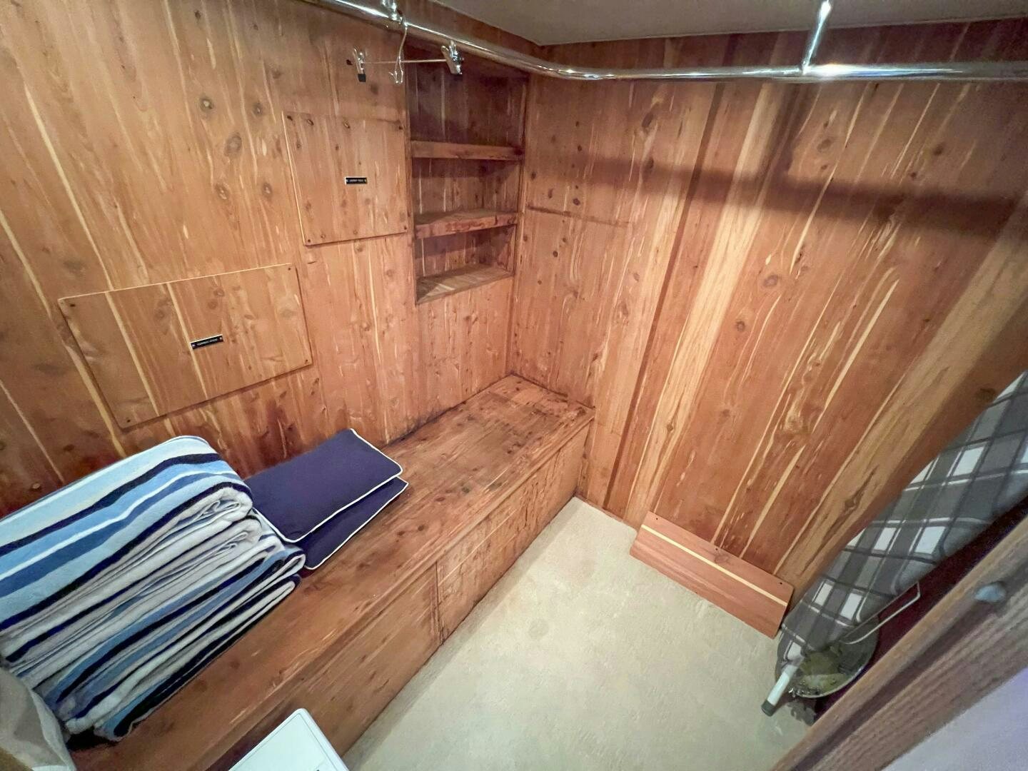 a room with wood walls and a bed aboard AT EASE Yacht for Sale