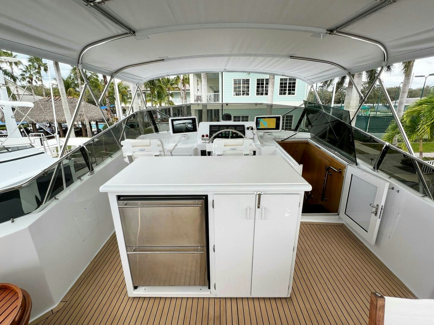 a large white room with a large white table and chairs aboard AT EASE Yacht for Sale