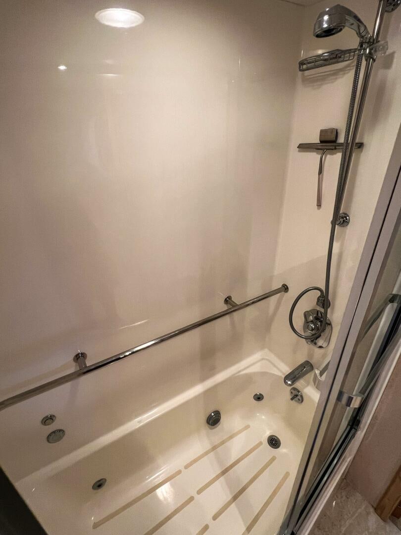 a shower with a glass door aboard AT EASE Yacht for Sale