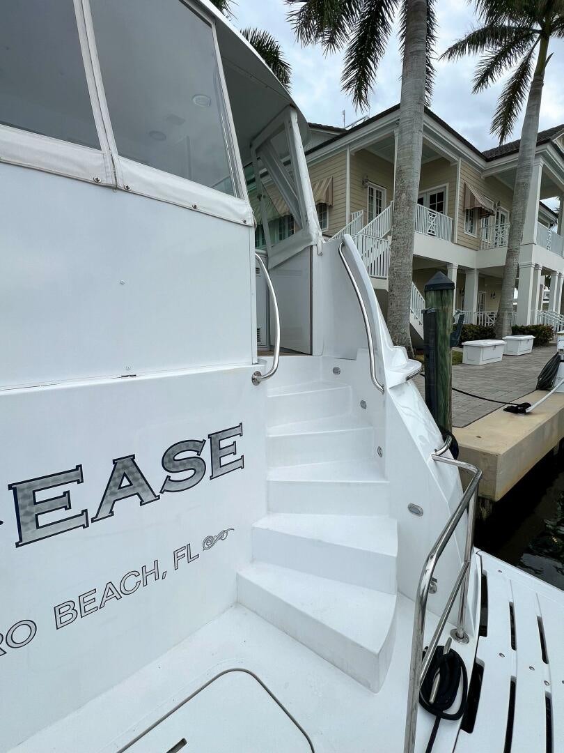 a white truck with black text aboard AT EASE Yacht for Sale