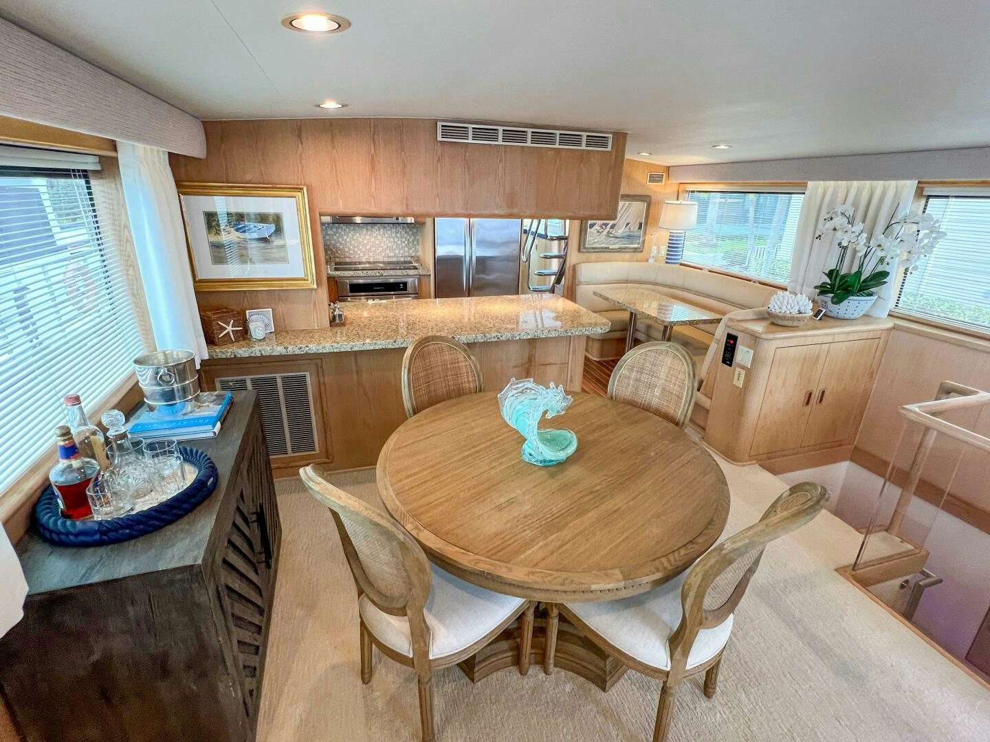 a kitchen with a dining table aboard AT EASE Yacht for Sale