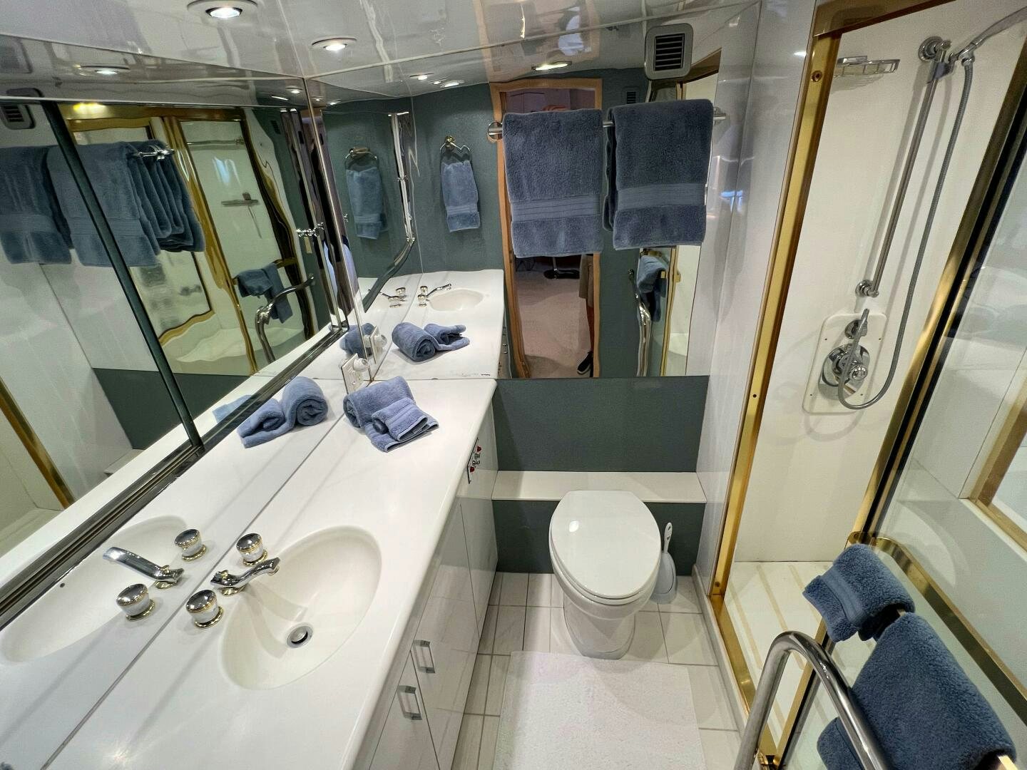 a bathroom with a sink and a toilet aboard AT EASE Yacht for Sale