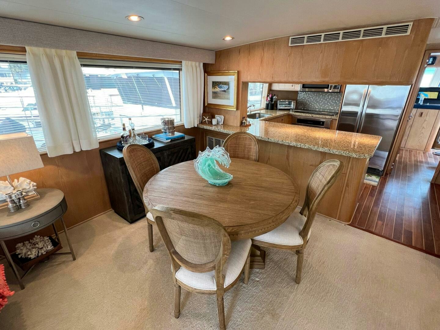 a kitchen with a table and chairs aboard AT EASE Yacht for Sale