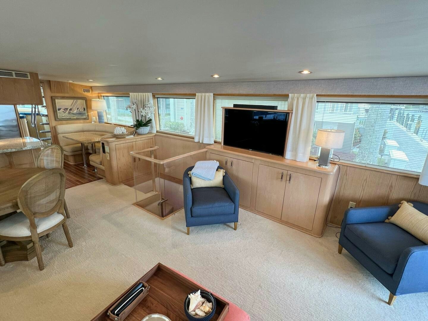 a living room with a large window aboard AT EASE Yacht for Sale