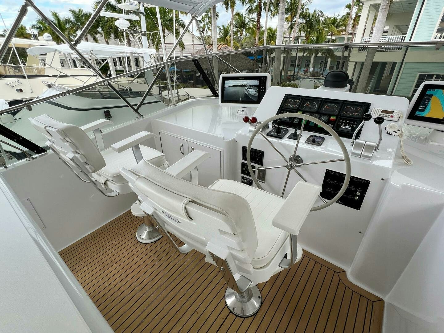 a white car with a seat aboard AT EASE Yacht for Sale