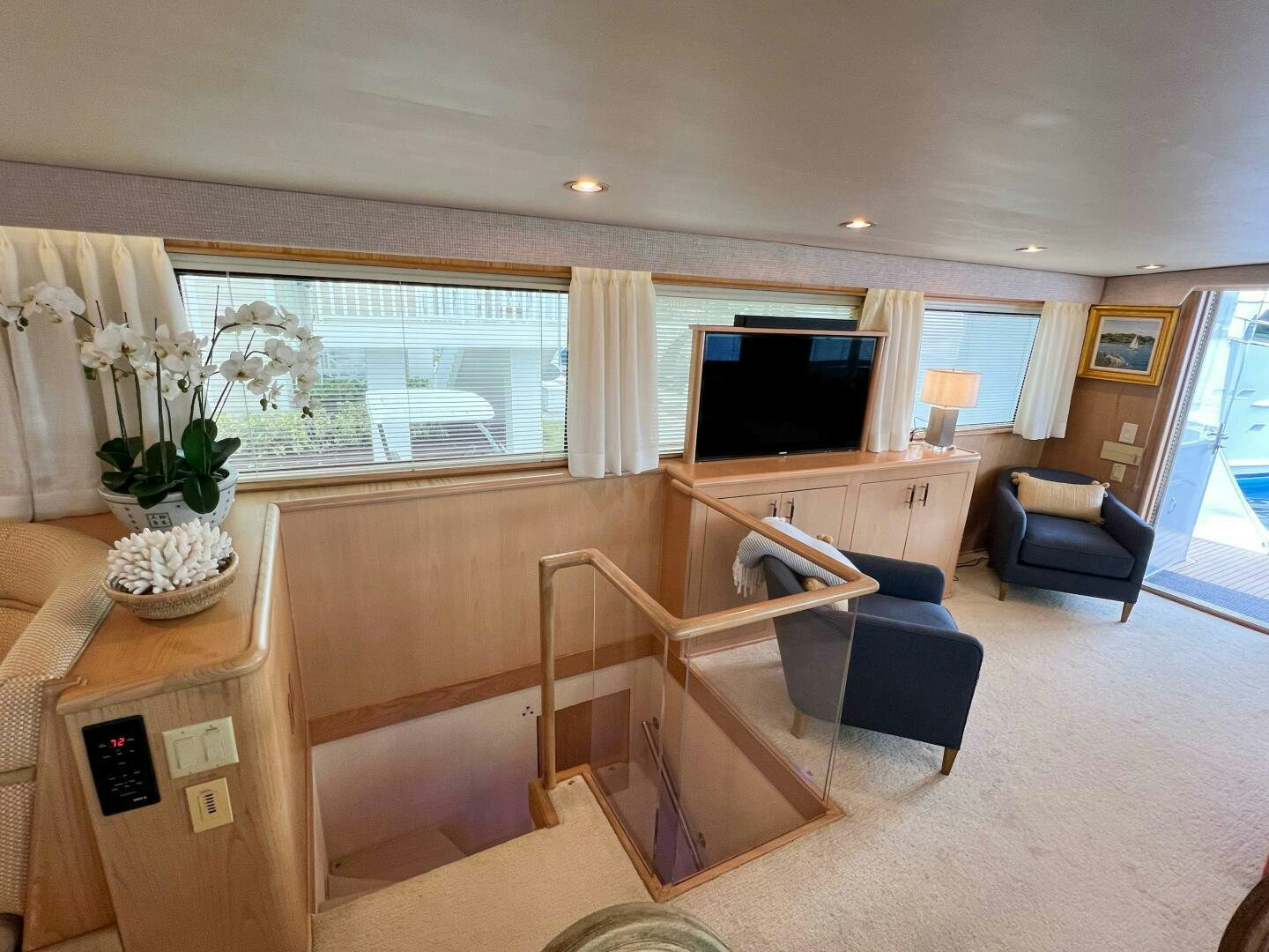 a living room with a large window aboard AT EASE Yacht for Sale