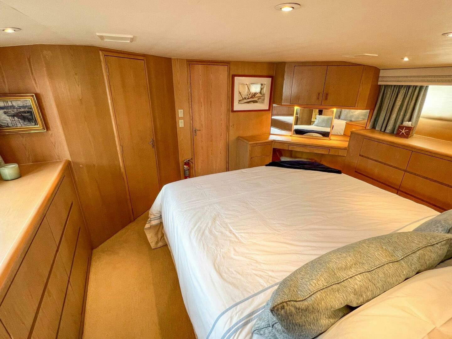 a bedroom with a bed and a desk aboard AT EASE Yacht for Sale