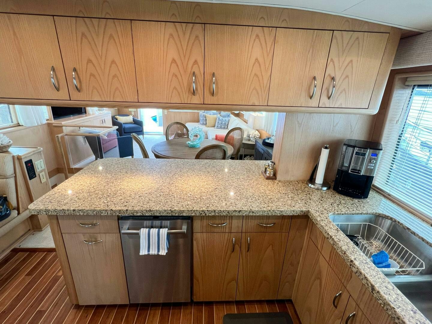 a kitchen with wooden cabinets aboard AT EASE Yacht for Sale