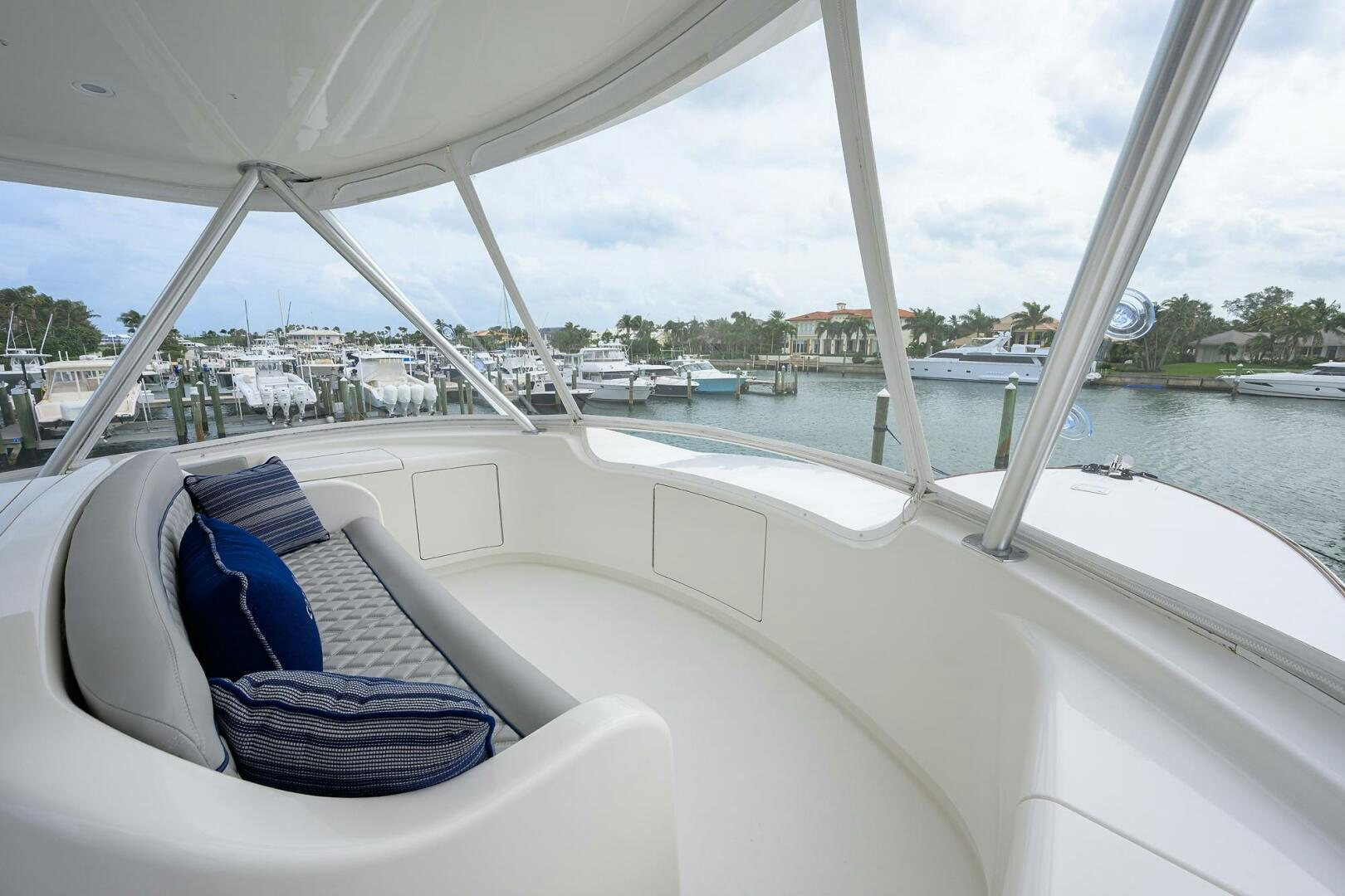 a boat with a blue seat and a pair of shoes on the front aboard CODE BLU Yacht for Sale