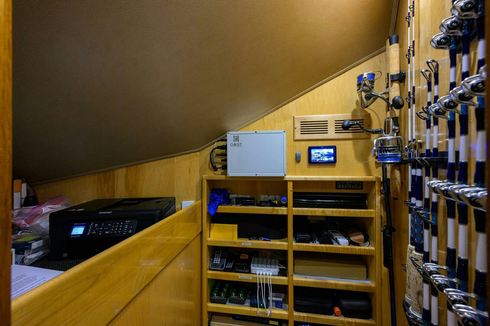 a computer on a desk aboard CODE BLU Yacht for Sale