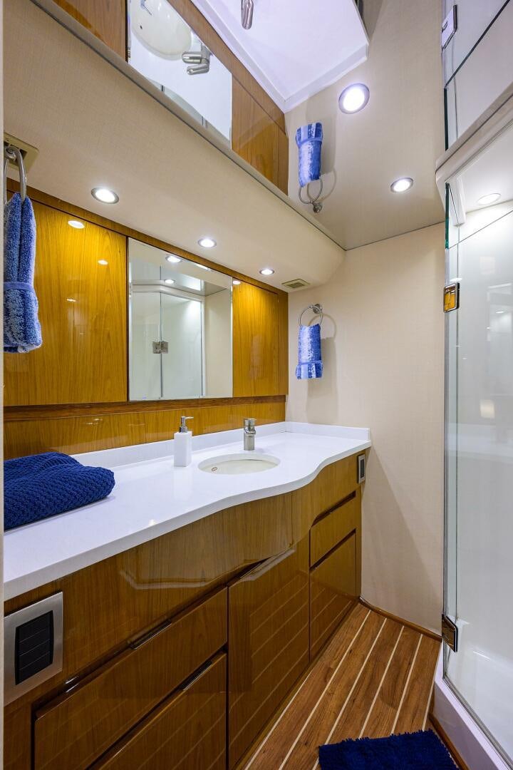 a bathroom with a sink and a mirror aboard CODE BLU Yacht for Sale