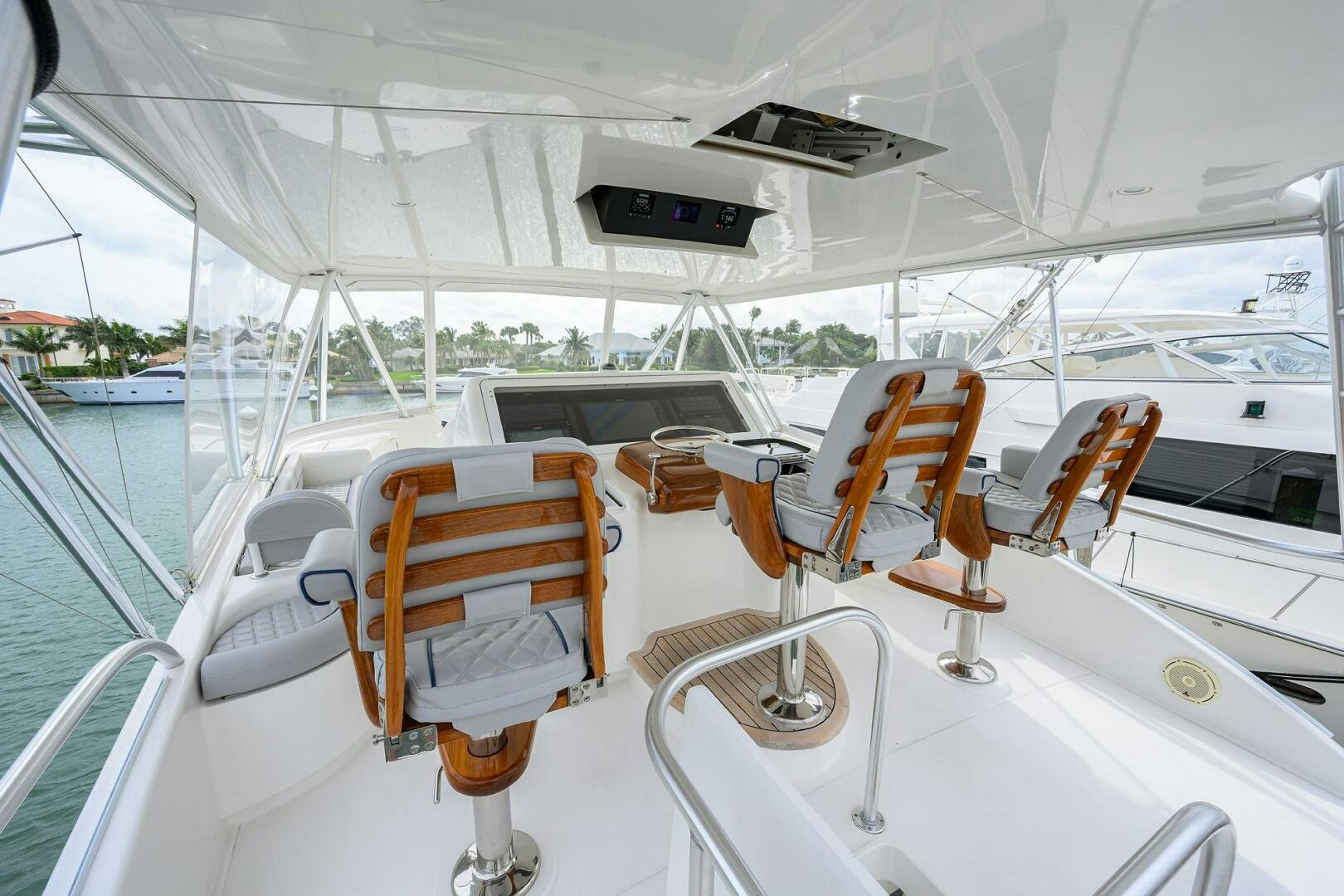 a boat with seats and a table aboard CODE BLU Yacht for Sale
