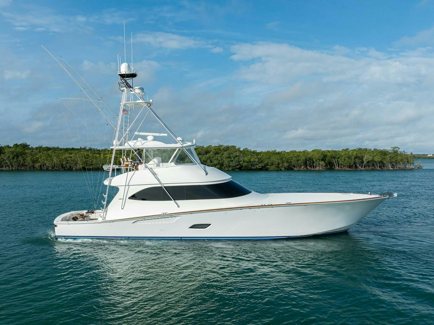 a white boat in the water aboard CODE BLU Yacht for Sale
