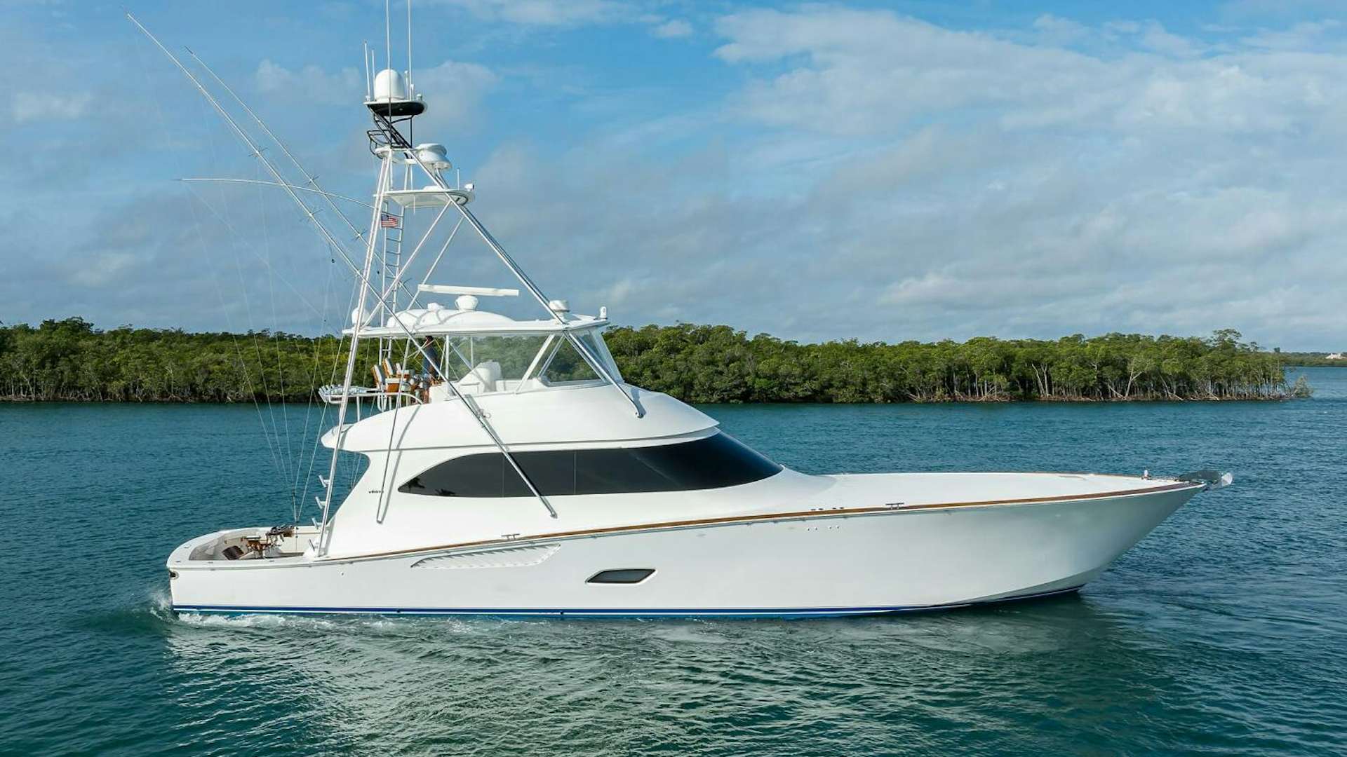 a white boat in the water aboard CODE BLU Yacht for Sale