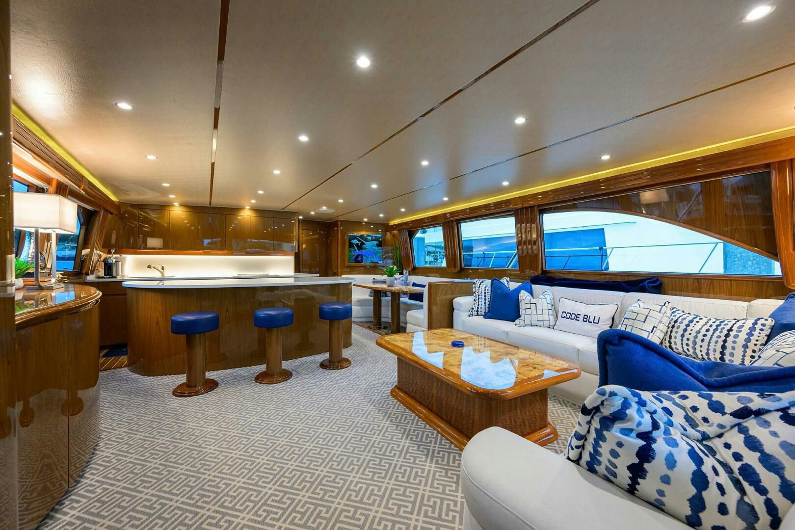 a large living room with a large window aboard CODE BLU Yacht for Sale