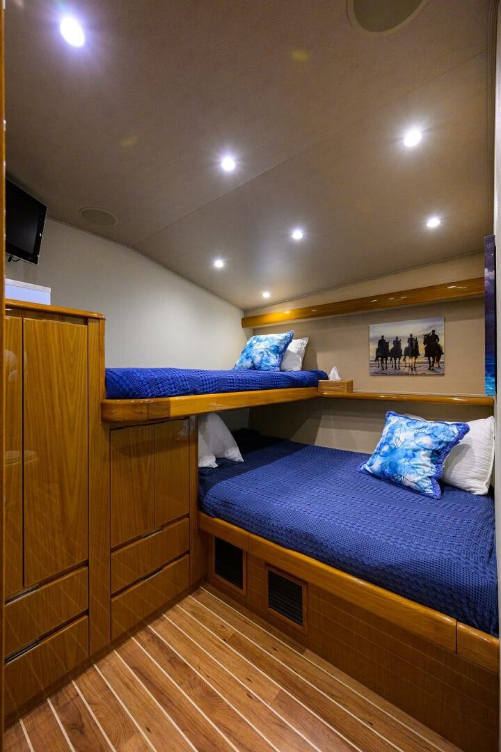 a couple of beds in a room aboard CODE BLU Yacht for Sale