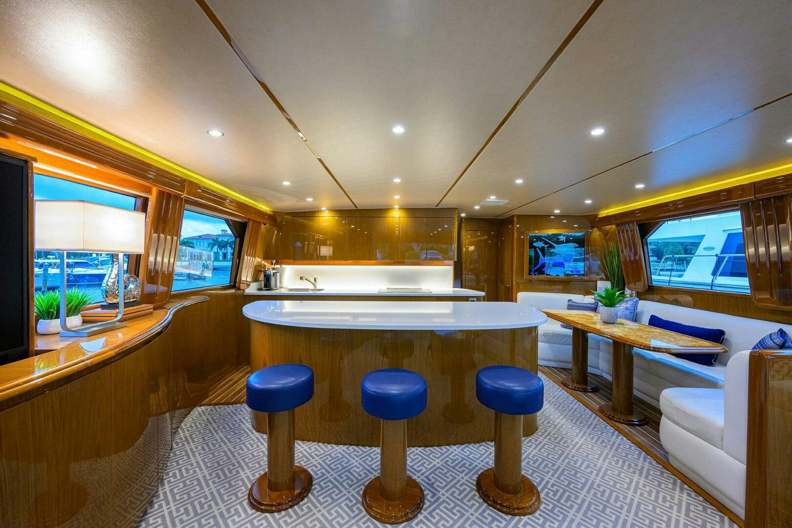 a room with stools and tables aboard CODE BLU Yacht for Sale