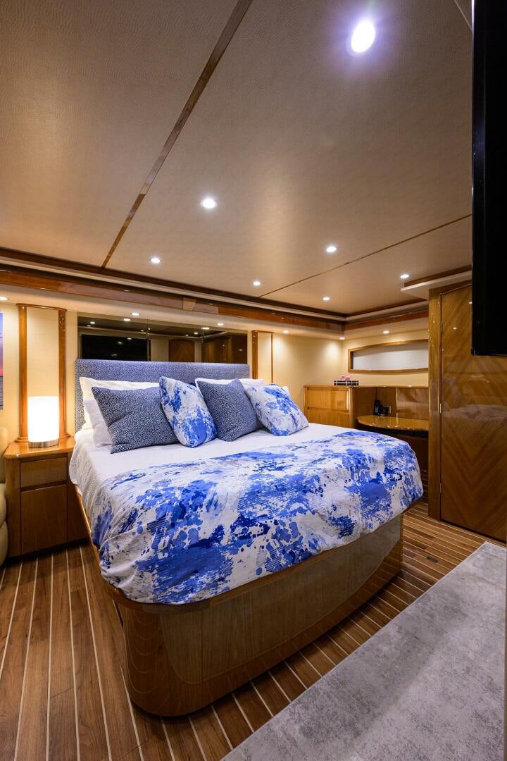a bed in a room aboard CODE BLU Yacht for Sale