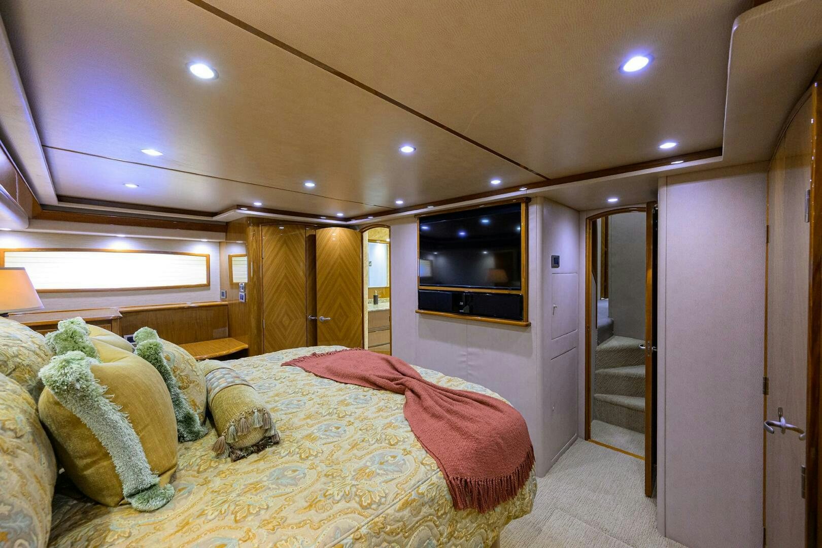a bedroom with a bed and a television aboard CABALLO GRANDE Yacht for Sale