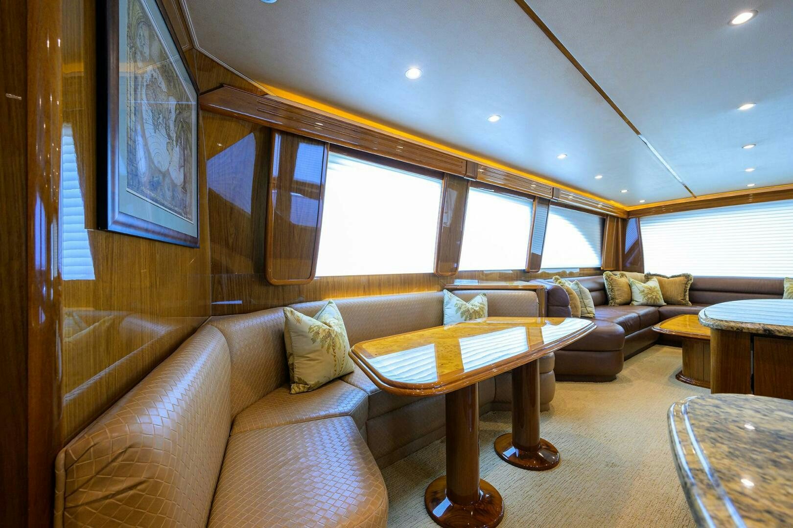 a living room with a couch and a table aboard CABALLO GRANDE Yacht for Sale