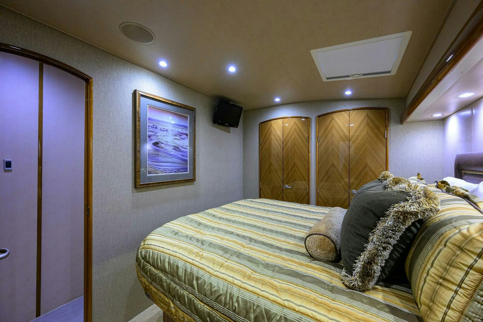 a bedroom with a bed and a window aboard CABALLO GRANDE Yacht for Sale