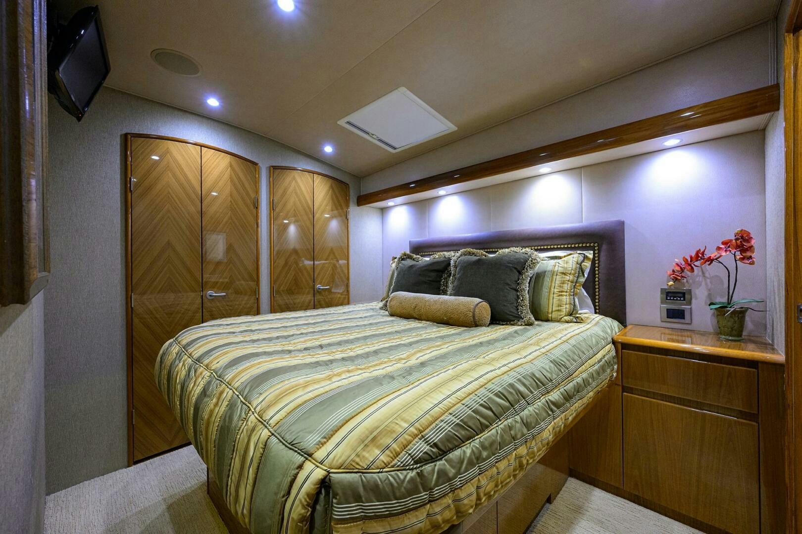 a bed with a pillow and a television on top of it aboard CABALLO GRANDE Yacht for Sale