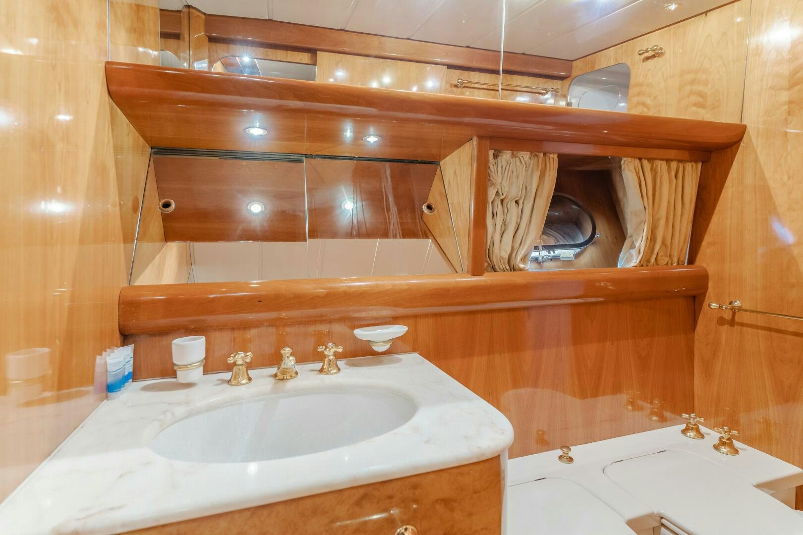 a bathroom with a sink and a mirror aboard C LADY Yacht for Sale