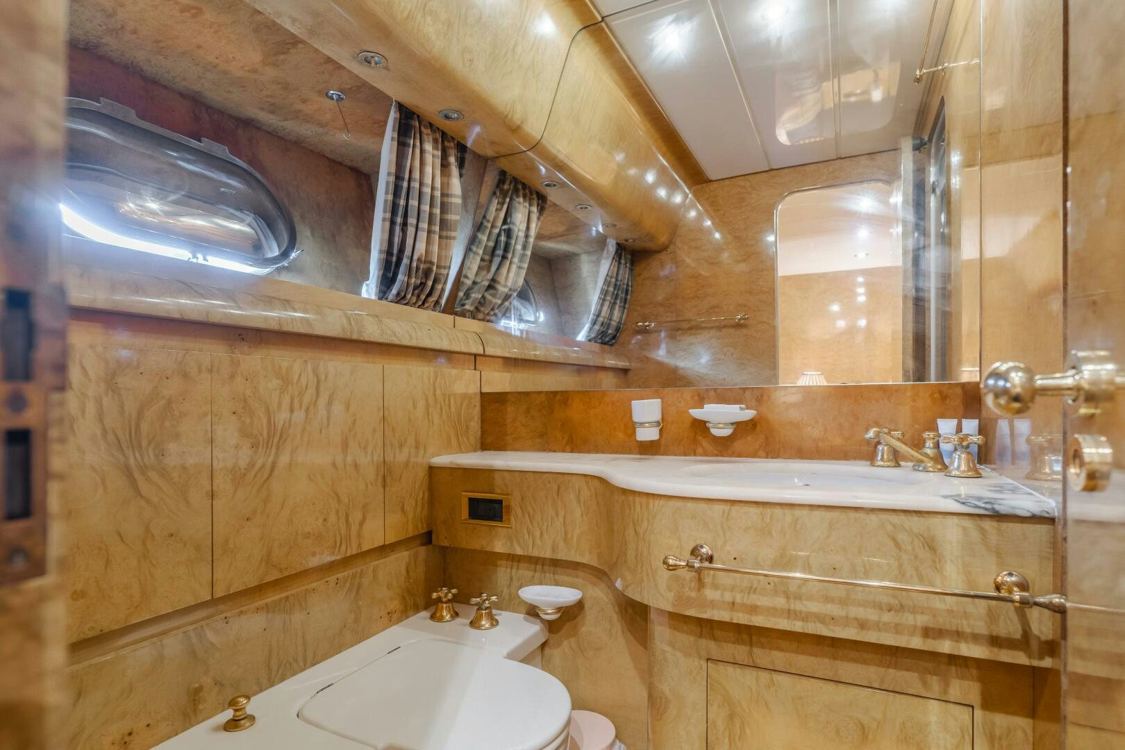 a bathroom with a sink and a mirror aboard C LADY Yacht for Sale