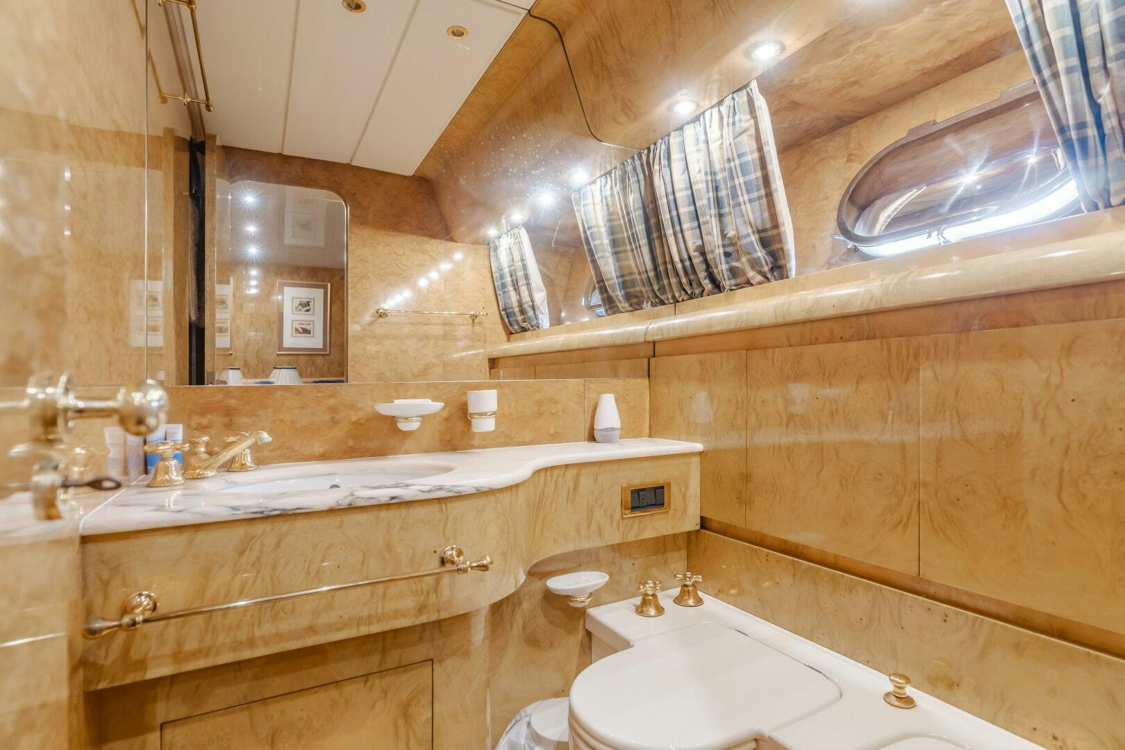 a bathroom with a large mirror aboard C LADY Yacht for Sale