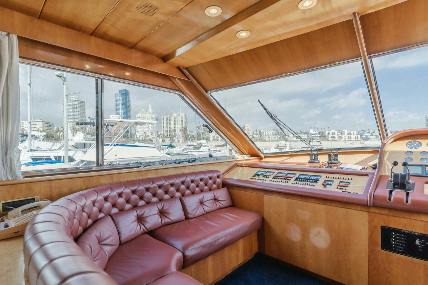 a living room with a large window aboard C LADY Yacht for Sale