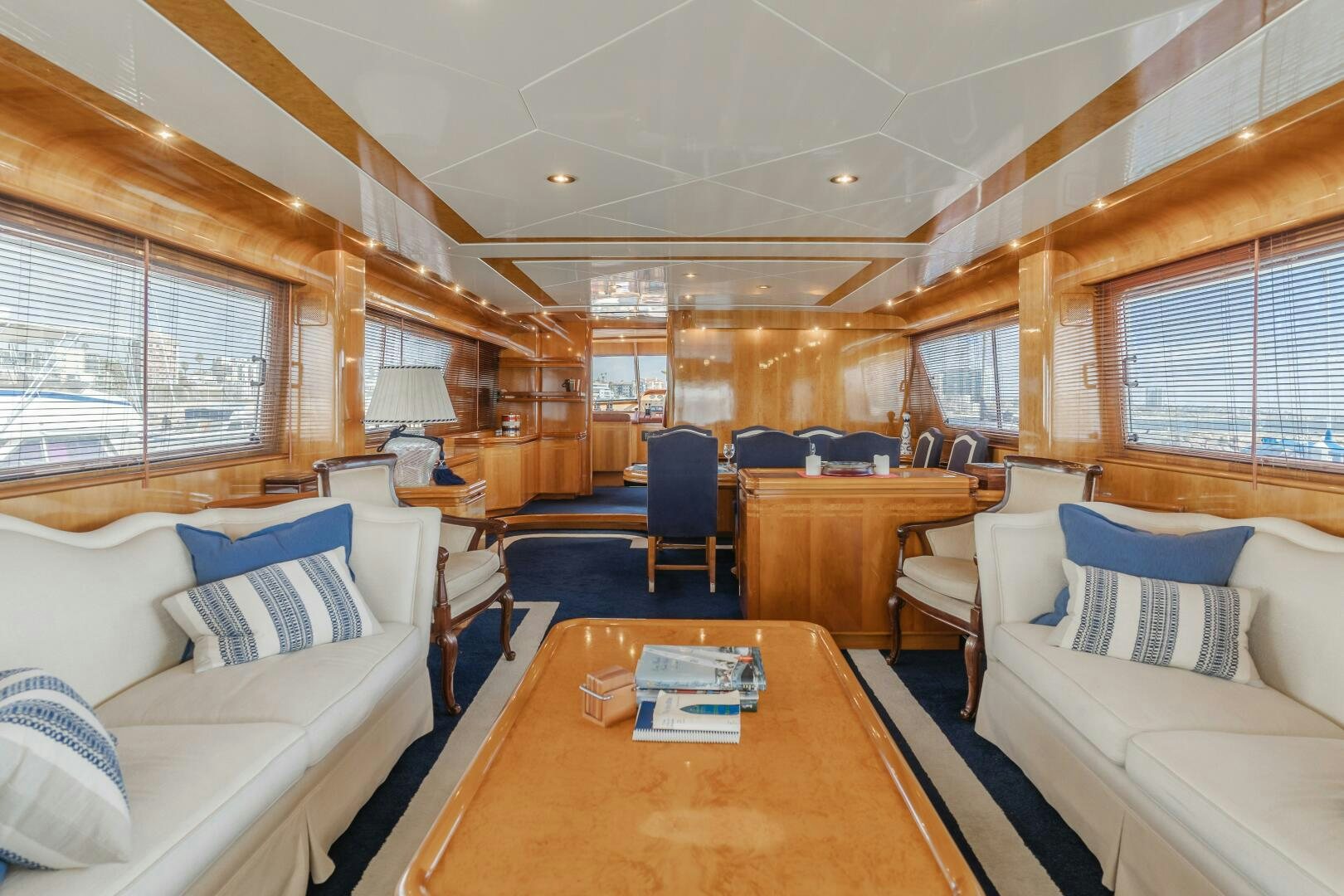 a room with a table and couches aboard C LADY Yacht for Sale