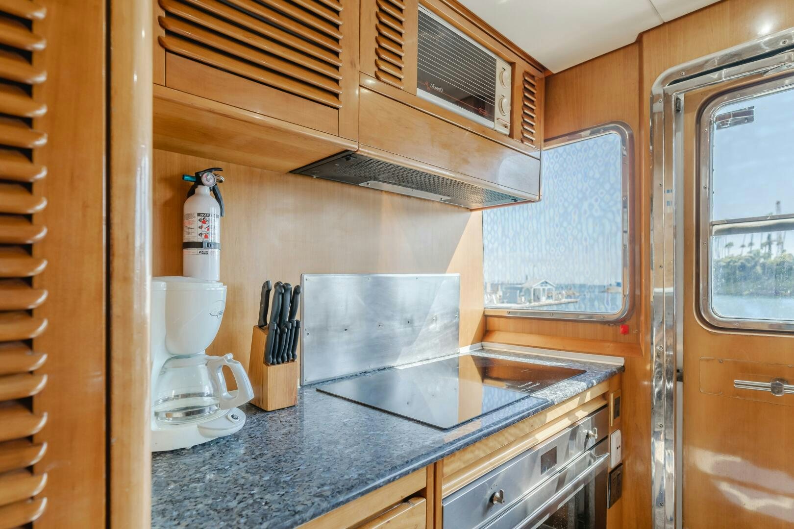 a kitchen with a stainless steel stove aboard C LADY Yacht for Sale