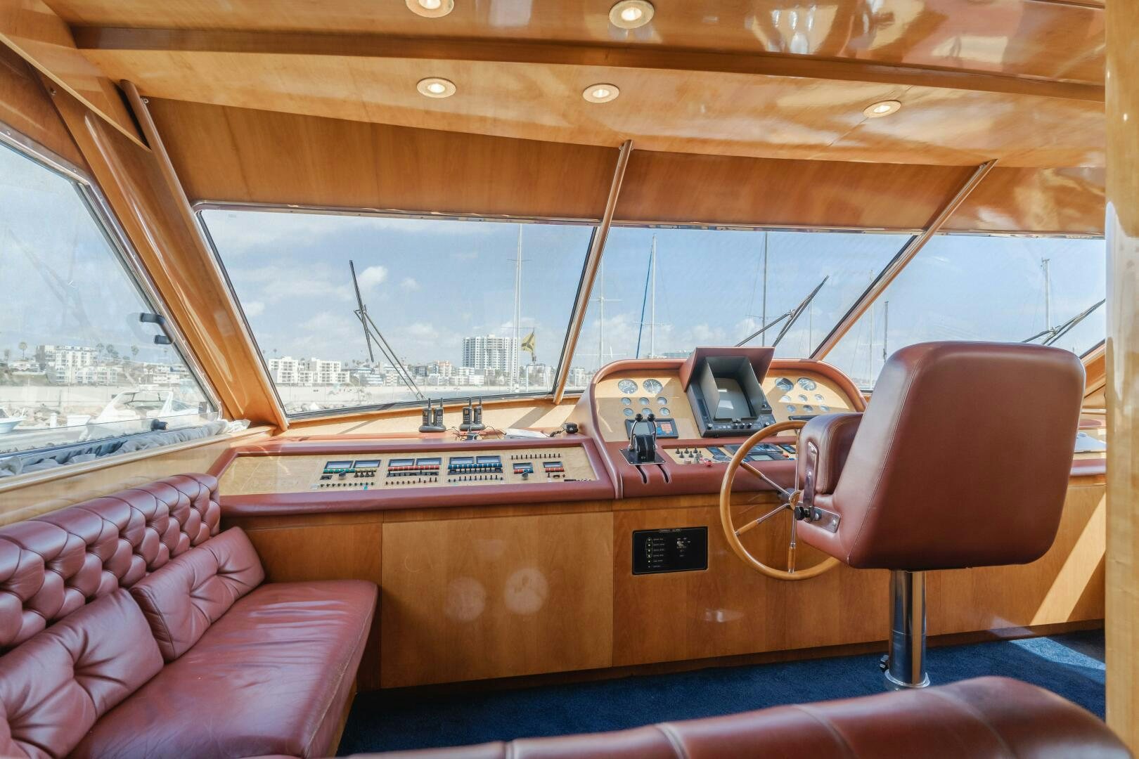 a wooden boat with a desk and a chair aboard C LADY Yacht for Sale