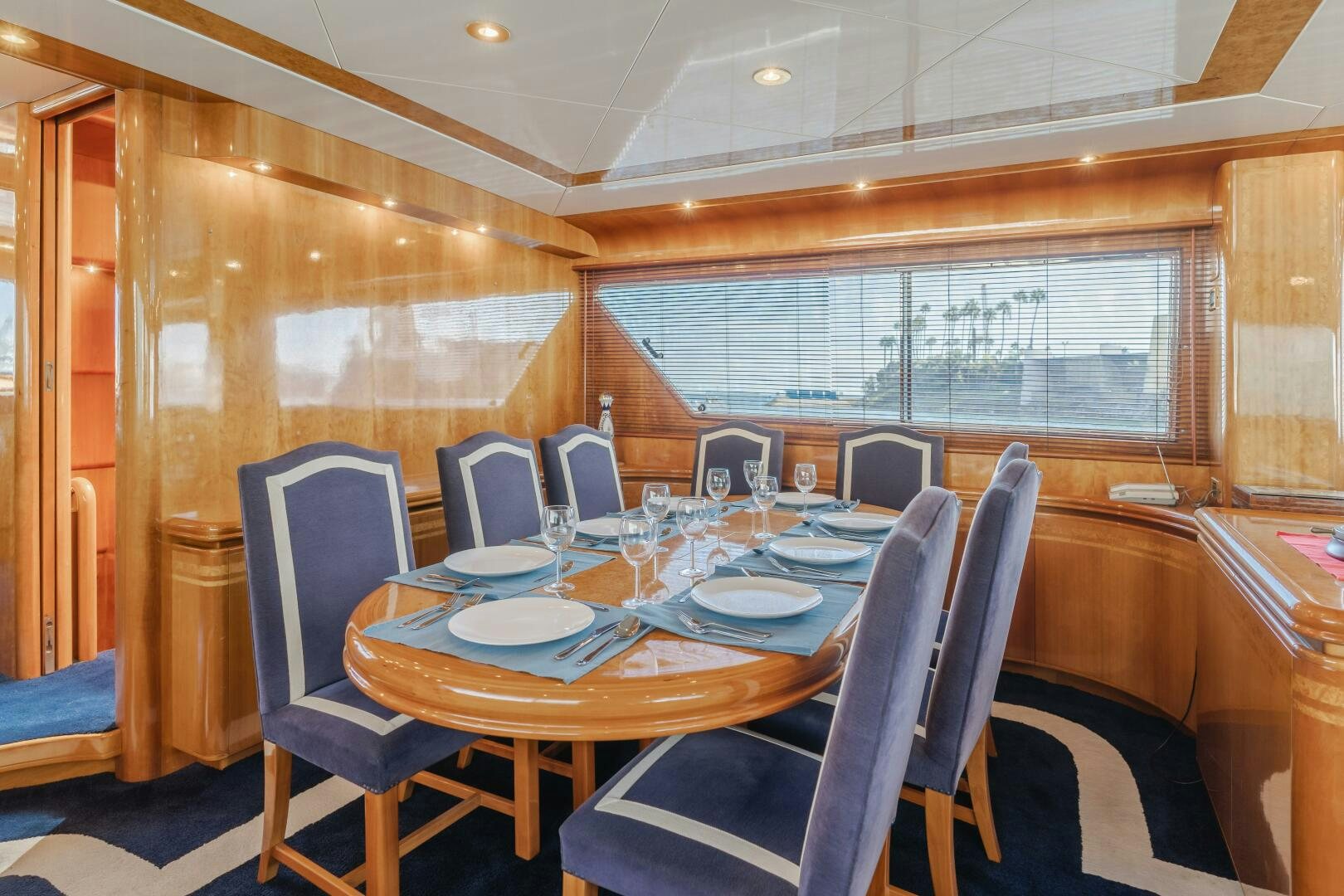 a dining room with a table and chairs aboard C LADY Yacht for Sale
